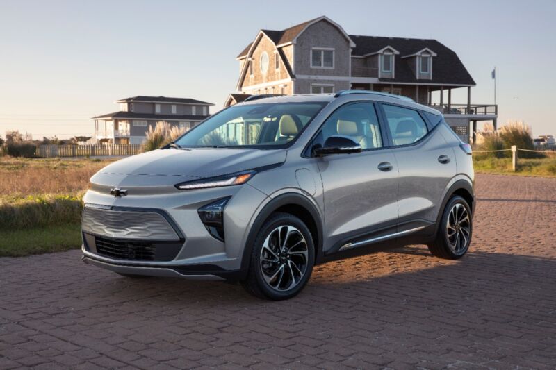 A Silver Chevrolet Bolt EUV next to a beach house