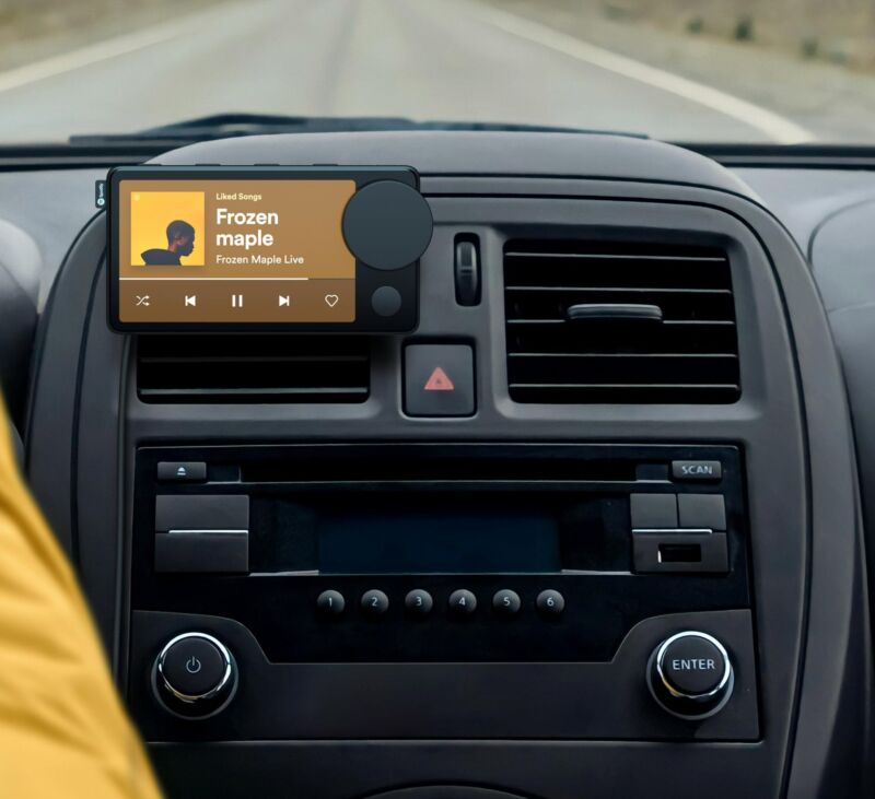 Spotify's Car Thing thing in a car. 