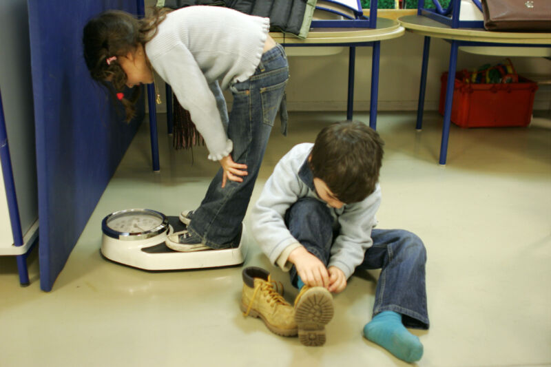 Children checking their weight. 