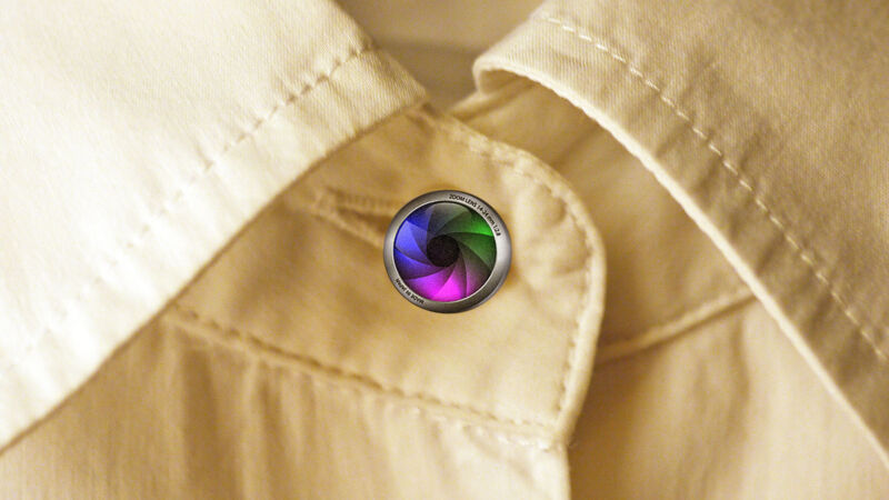 A photo illustration of what a shirt-button camera <em>could</em> look like. “><figcaption class=