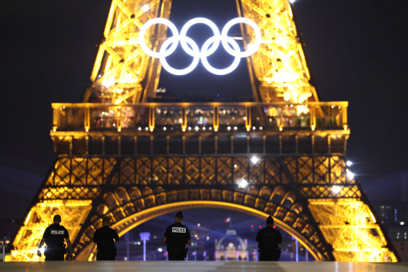 Police observe the Eiffel Tower from Trocadero ahead of the Paris 2024 Olympic Games.