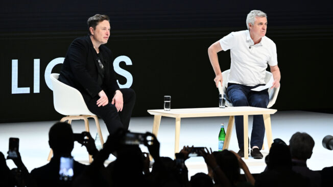 elon musk and mark read on stage at Cannes