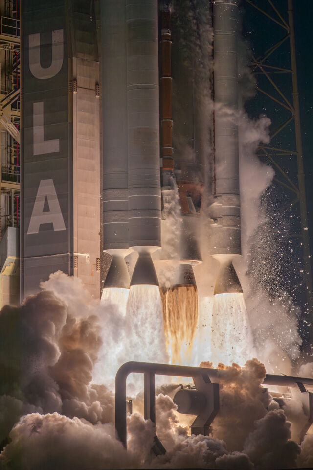 A cluster of solid rocket boosters surround the RD-180 main engine as the Atlas V launcher climbs away from Cape Canaveral Space Force Station to begin the USSF-51 mission.