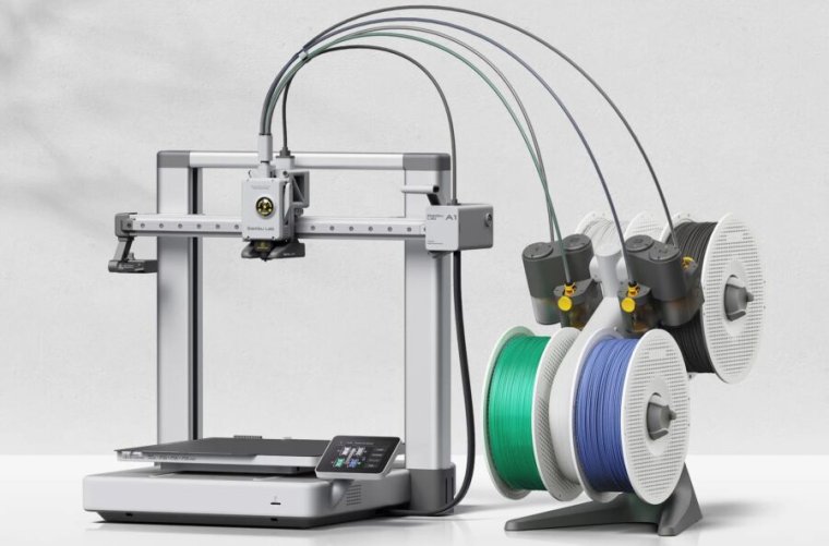 Bambu Lab A1, with three filament spools connected by circular loops off to the right.