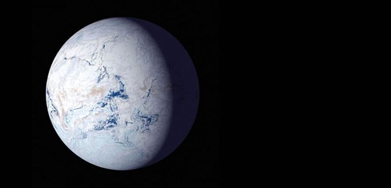 Image of a white planet with small patches of blue against a black background.