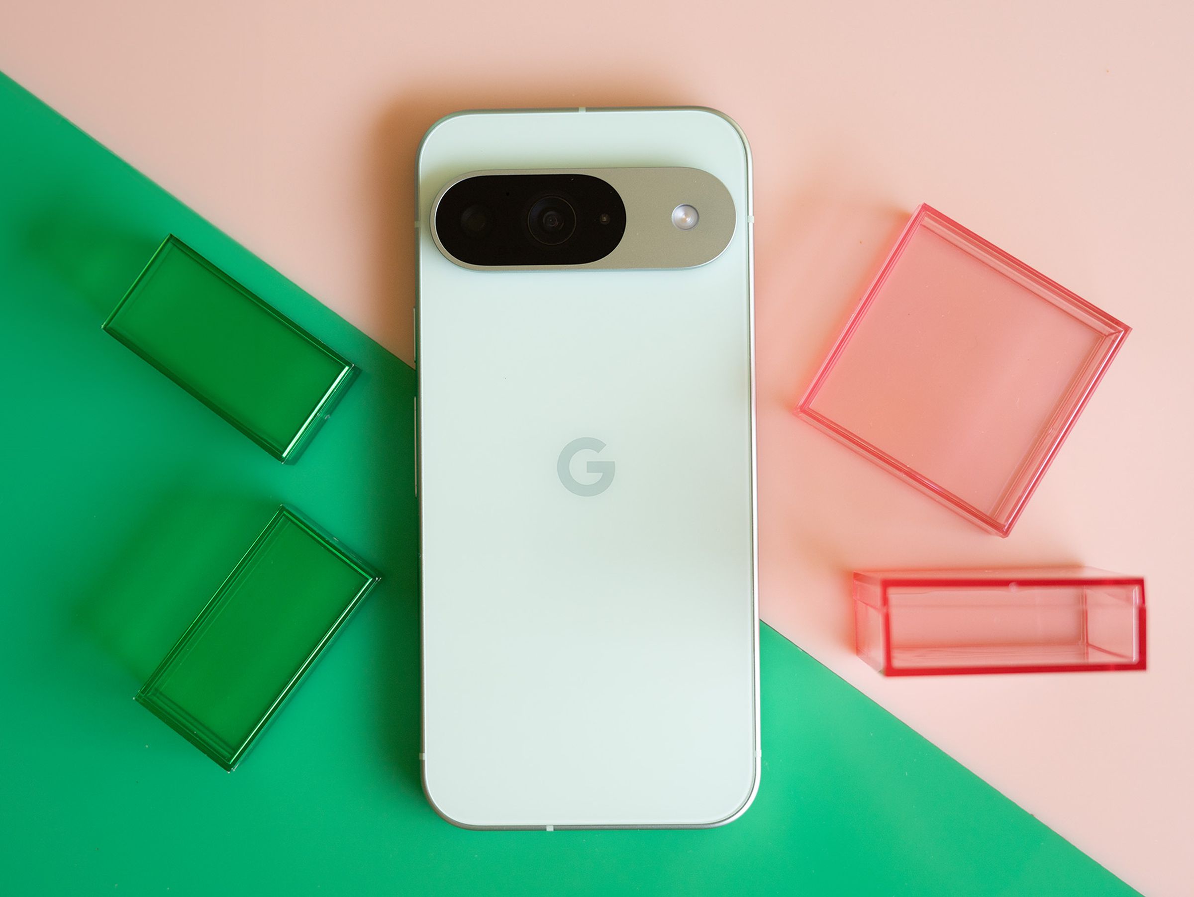 Google Pixel 9 on a pink and green background.