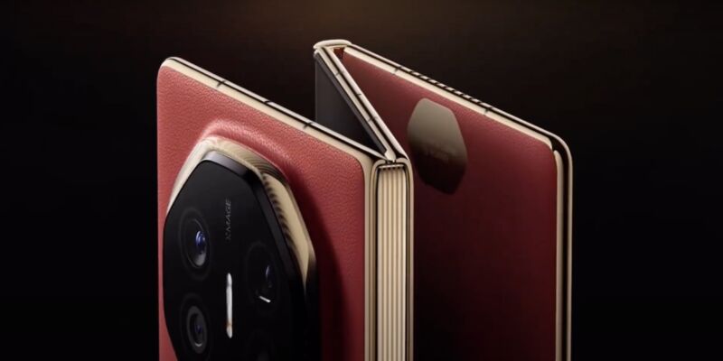 Shot of a red phone that folds into three, against a black background