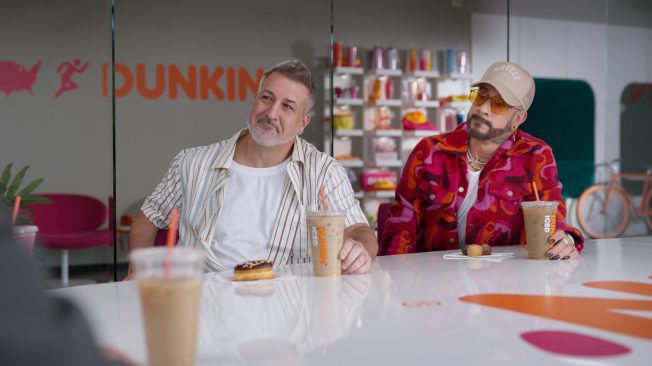 *NSYNC’s Joey Fatone and the Backstreet Boys’ A.J. McLean holding iced coffee.