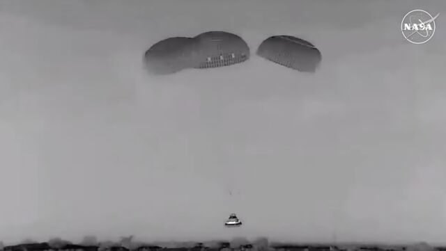 In this infrared view, Starliner descends under its three main parachutes moments before touchdown at White Sands Space Harbor, New Mexico.