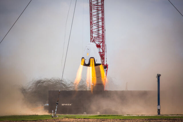 A hover test using SuperDraco thrusters on a prototype Crew Dragon spacecraft in 2015.