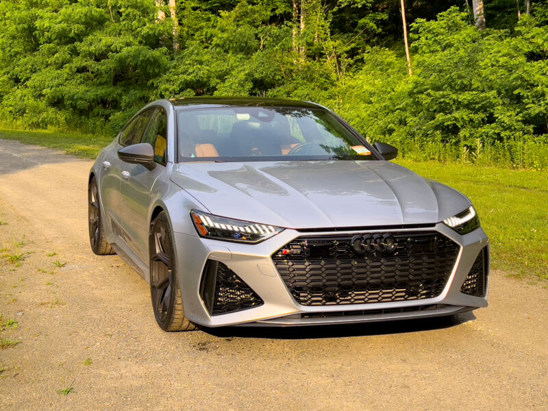 A silver Audi RS7 parked in a clearing