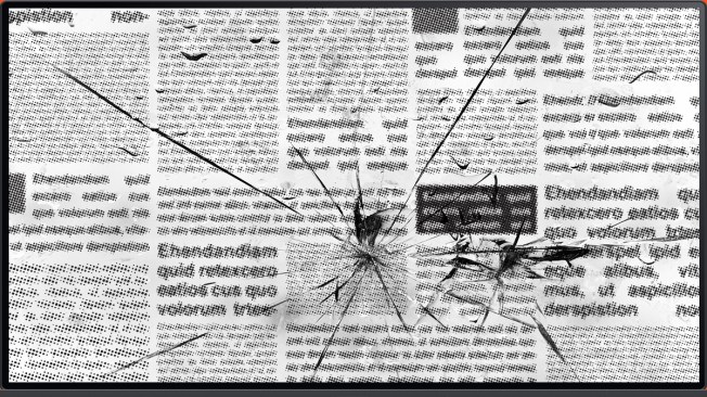 newspaper on cracked screen