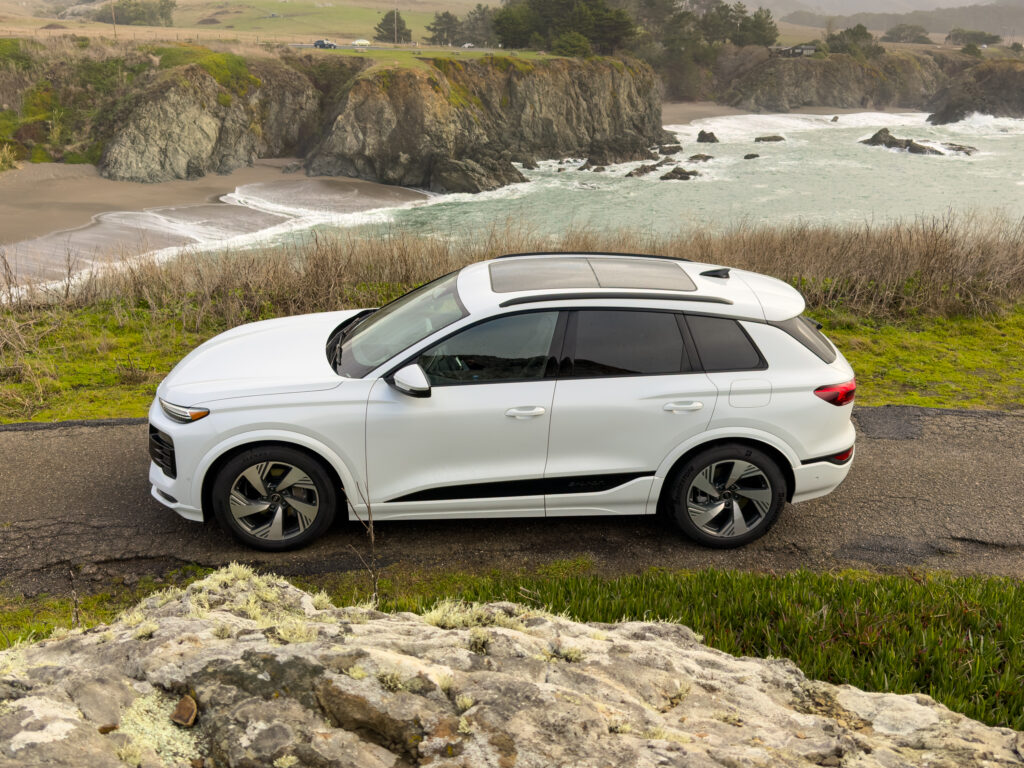 A white Audi Q6 seen parked by a cliff