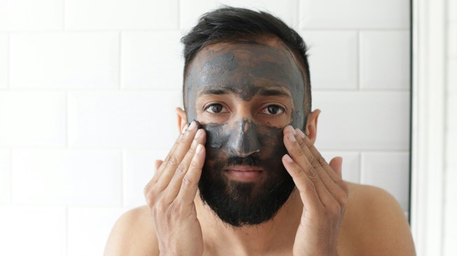 man applying a face mask