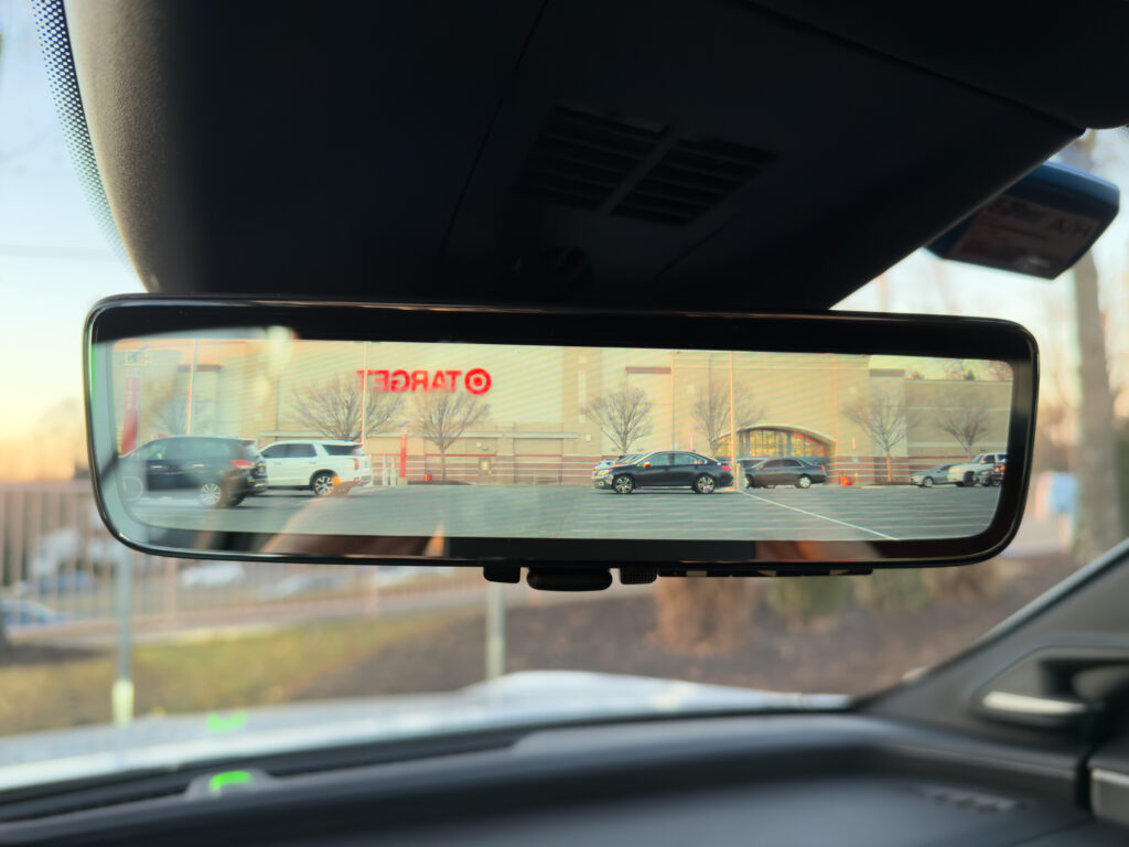 A rear view mirror, with a Target visible in the background.